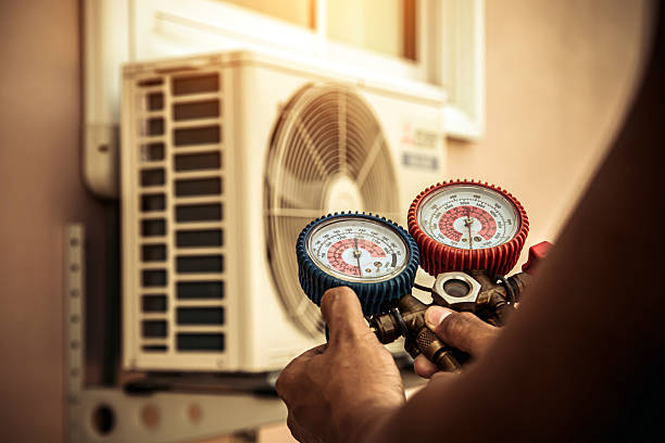 Professional Air Conditioning Service technician working in Dravosburg, PA